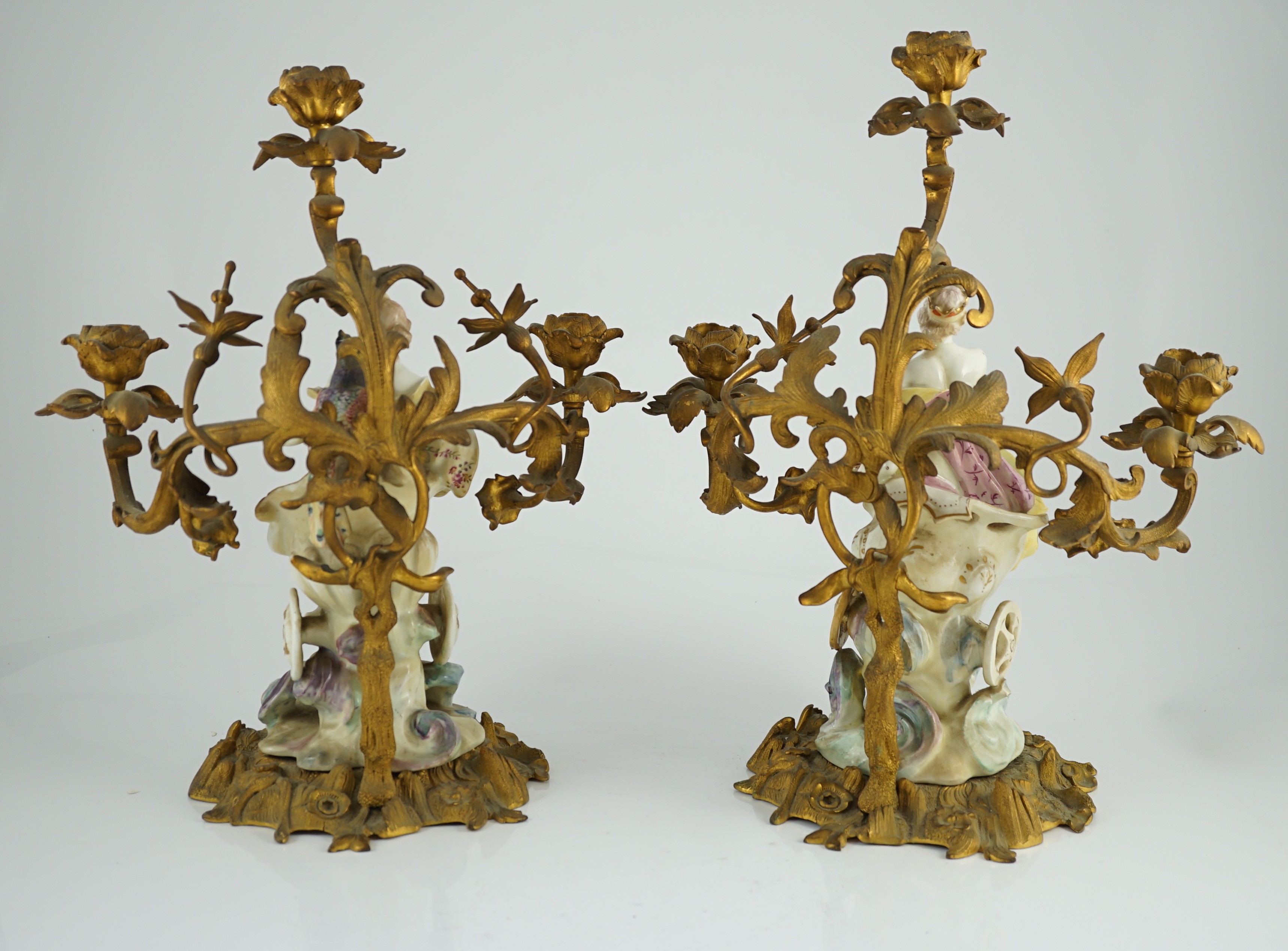 A pair of large Derby porcelain and ormolu mounted ‘Juno and Jupiter’ figural candelabra, the figures c.1760